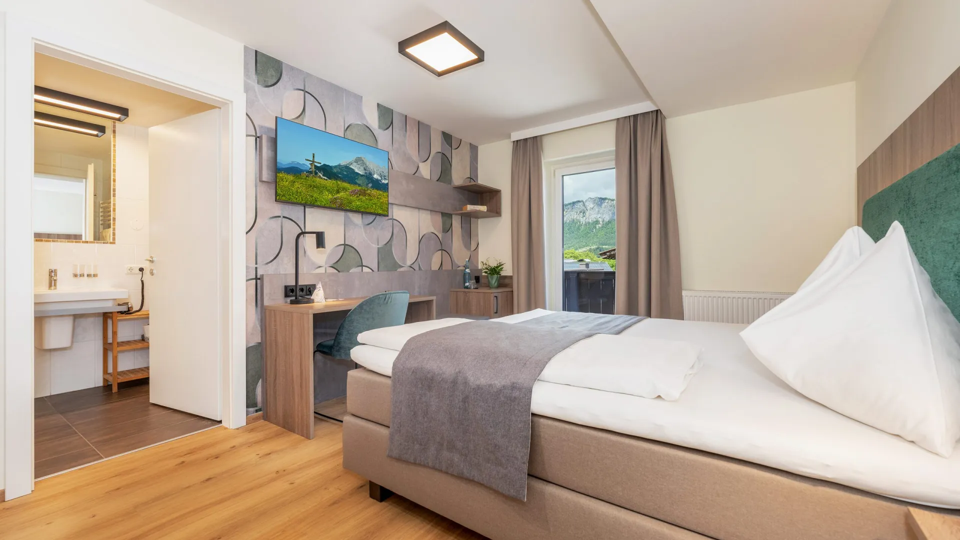 Doppelzimmer zur Einzelbenützung mit Doppelbett und Schreibtisch